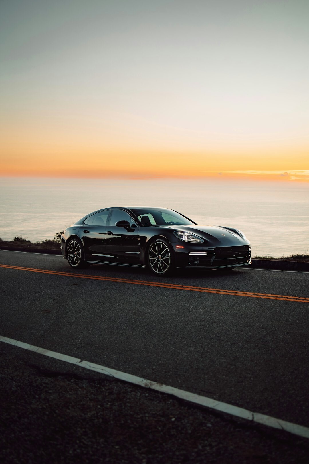 luxury car on coastal road