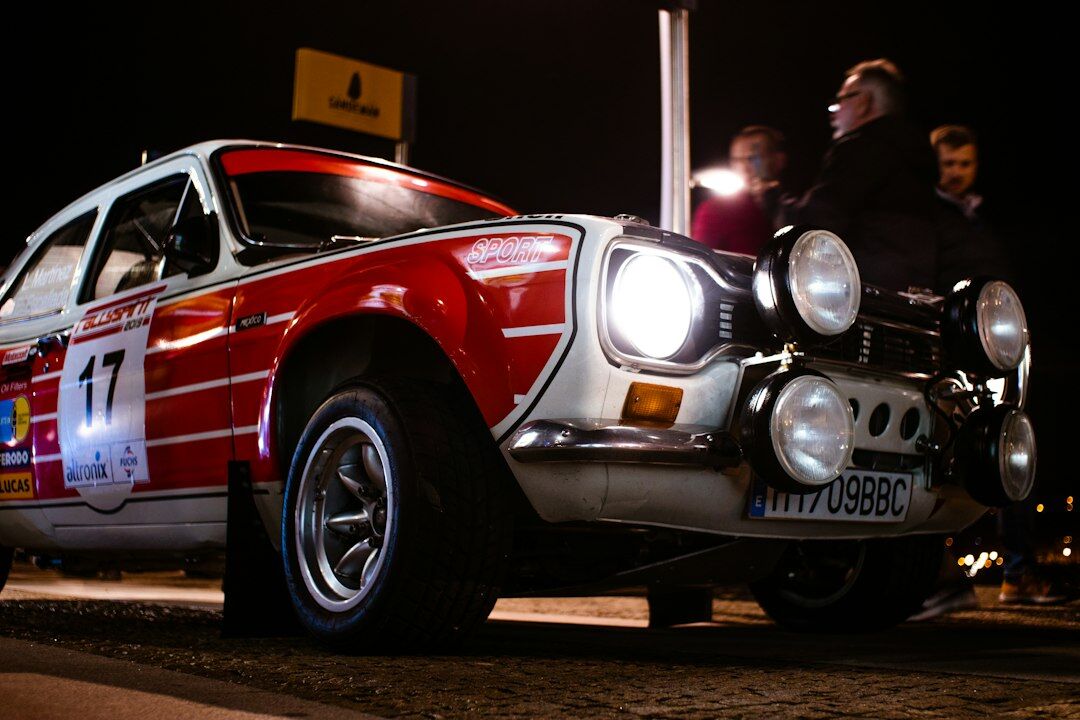 European grand tourer automobile from 1967 displayed under museum spotlight for virtual exploration