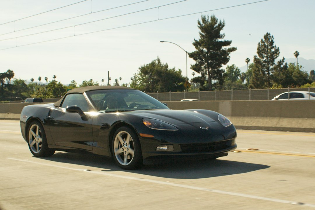 luxury sports car driving on highway