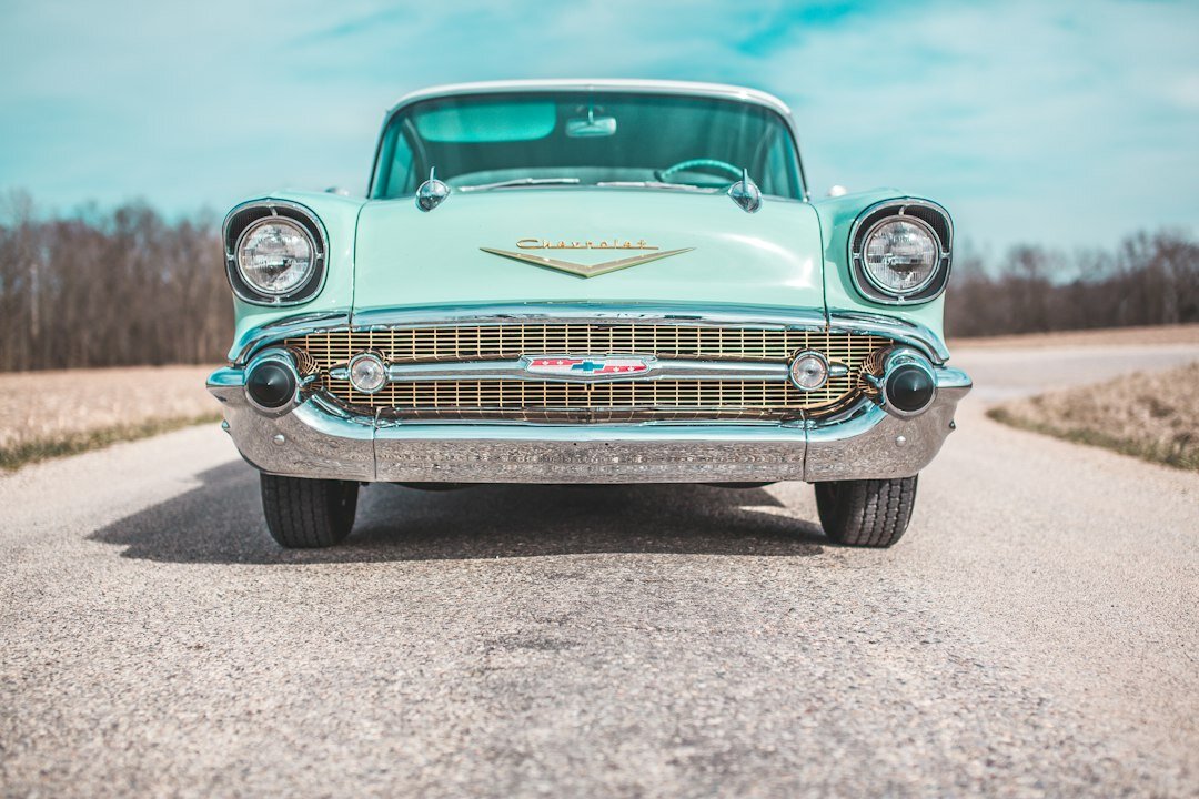 Restored 1950s classic automobile with chrome bumpers and whitewall tires