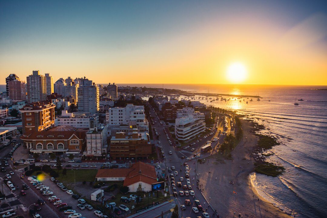 Group of classic convertibles parked along a beach promenade in Punta del Este in summer