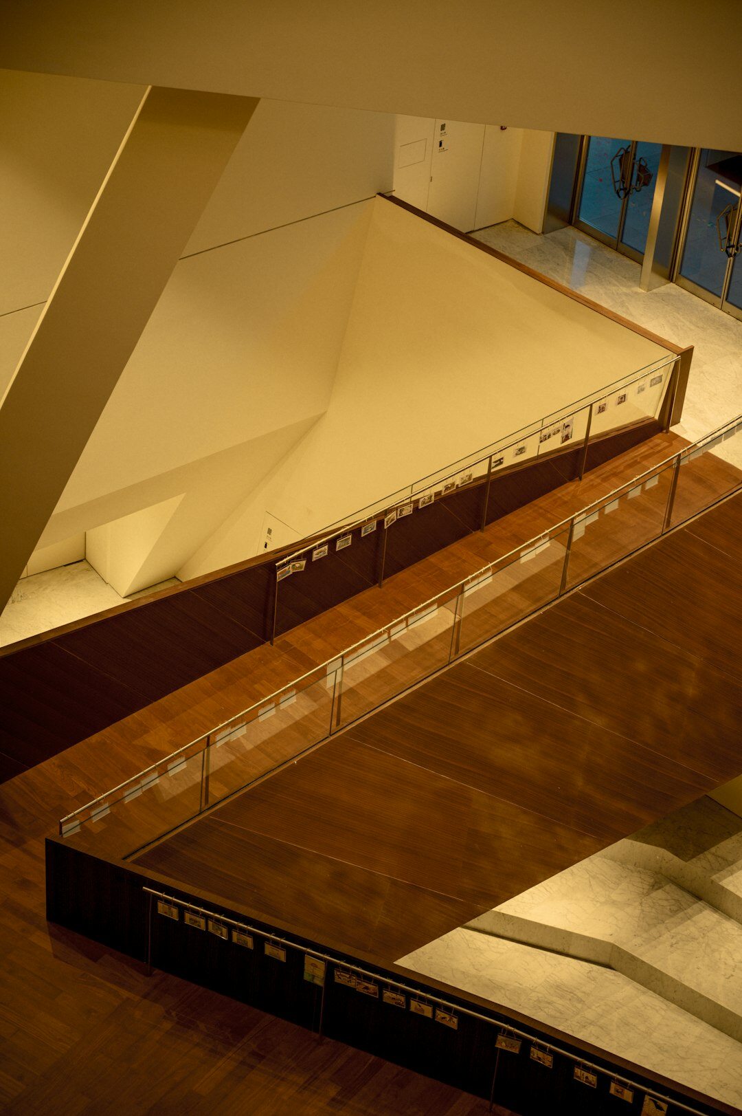 Modern hypercar displayed on a rotating platform at an exhibition hall