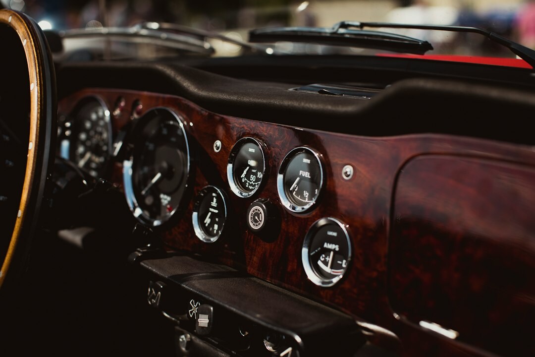 Leather interior and wooden dashboard detail of a vintage luxury automobile
